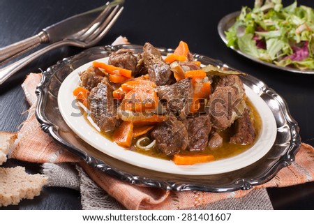 Delicious bourguignon beef stew on white plate. Selective focus