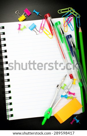 School education background with blank exercise book with copy space. Back to school concept. Top view.