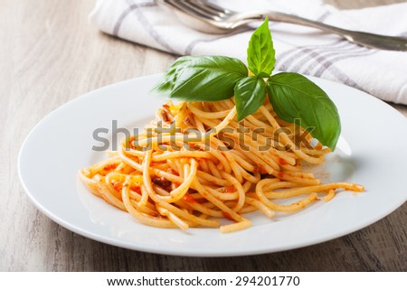 Spaghetti al pomodoro, one of the simplest Italian rustic dishes with the pasta tossed in a sauce of tomato, basil, garlic and a little sugar and oil.