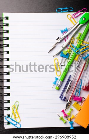 School education background with blank exercise book with copy space. Back to school concept. Top view.
