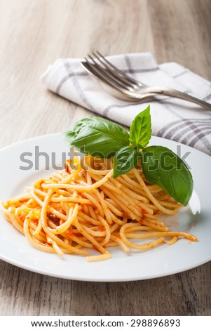 Spaghetti al pomodoro, one of the simplest Italian rustic dishes with the pasta tossed in a sauce of tomato, basil, garlic and a little sugar and oil.