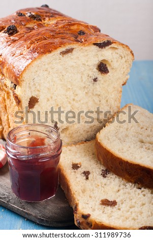 Tasty sliced raisin bread and jam for breakfast. Healthy food background.