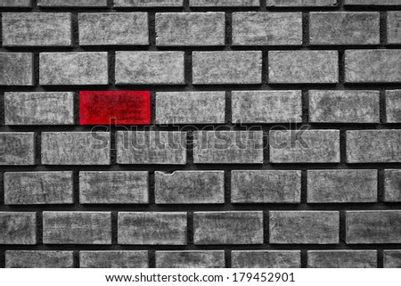 red color brick in an all gray wall