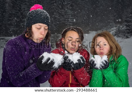 girls having fun in the snow on huge snowfall