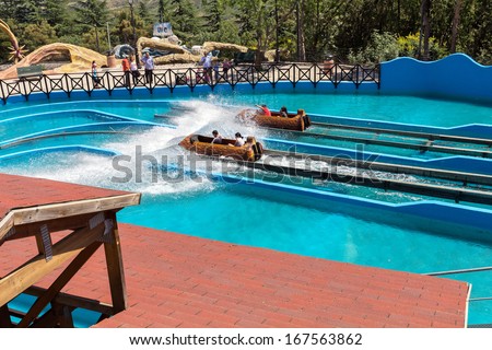 GEORGIA - JULY 03: Water game in a hollowed trunk at an amusement park \