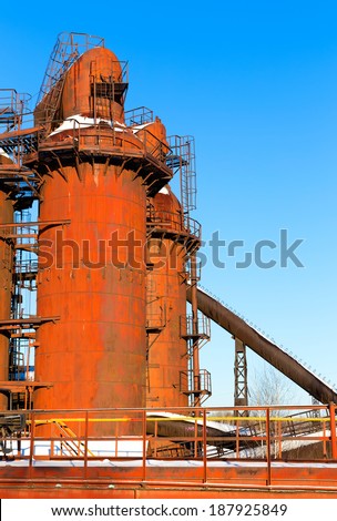 Old Steel Works against the blue cloudless sky