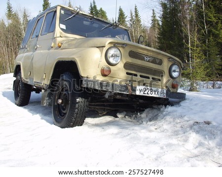 RUSSIA - MAY 07, 2006: Russian off-road vehicle fell into a deep snow