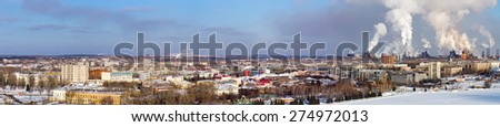 NIZHNY TAGIL, RUSSIA - FEBRUARY 07, 2015: Environmental problem of environmental pollution and air in large cities. Bird\'s-eye view on the central city Nizhny Tagil