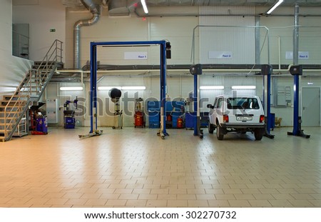 MOSCOW, RUSSIA - JULY 01, 2015: Cars for repair service station. Auto Service is the official dealer of Auto VAZ