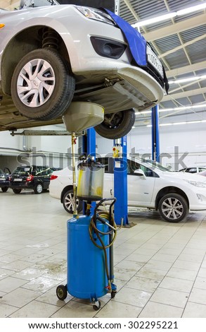 MOSCOW, RUSSIA - JULY 01, 2015: The car on the lift. Change engine oil and transmission inspection