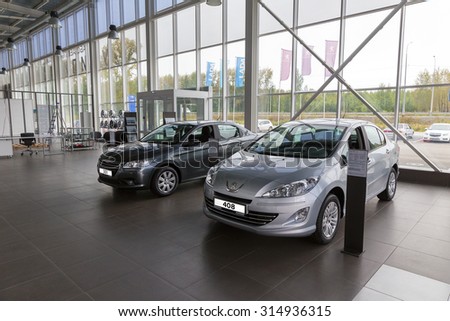 MOSCOW, RUSSIA - AUGUST 19, 2015: Selling cars Peugeot 301 and 408 in the showroom. New products automaker Peugeot