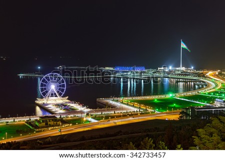 Baku, Azerbaijan - September 23, 2015: Night view of the city of Baku. Ferris wheel and the largest flag in the world