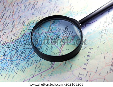 Kuwait on a map close up with magnifier