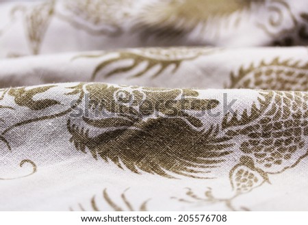 Linen cloth with a dragon pattern close up