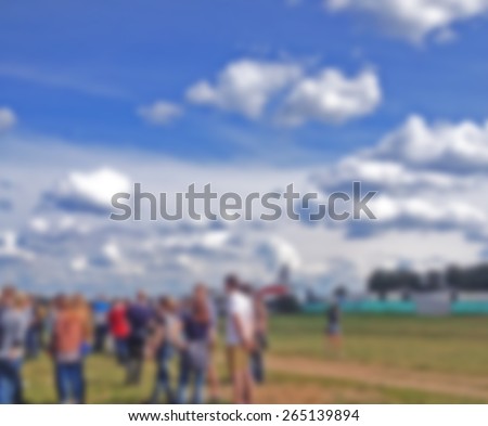 Blurred crowd at the concert in the field