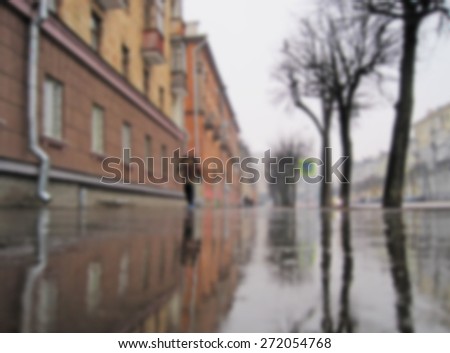 Blurred city street in the rain background