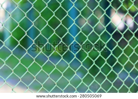 Blurred grid fence close up