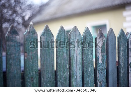 Vintage wooden pointy fence close up