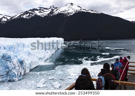 CALAFATE-NOVEMBER, 2014: People watching the collapses on the glacier located in the Los Glaciares National Park in the south west of Santa Cruz province, Argentina on november 23, 2014