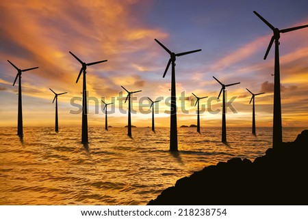 Wind turbines and sunset in the sea
