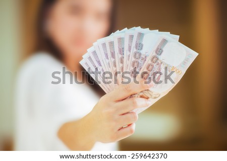 Handle money with woman hand