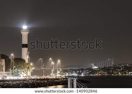 Night view on Bosphorus Bridge and Lighthouse in Istanbul, Turkey