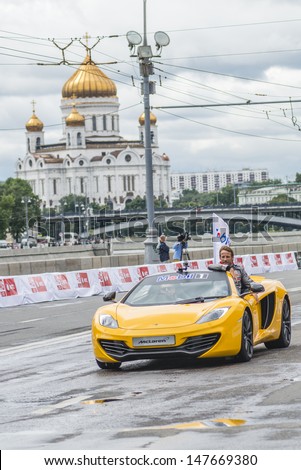 MOSCOW, RUSSIA - JULY 21 2013: Professional F1 Racing driver Jenson Button in Moscow City Racing weekend, Moscow on 21 July 2013, Russia