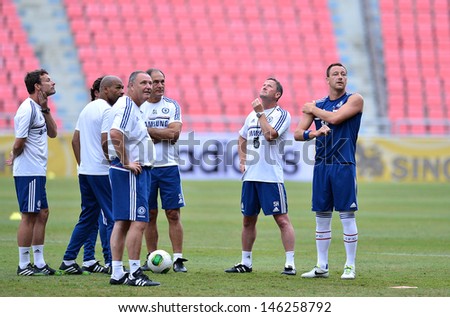 BANGKOK,THAILAND- JULY 16: John Terry (Right) and staff coach during a Chelsea FC training session at Rajamangala Stadium on July 16, 2013 in Bangkok, Thailand.