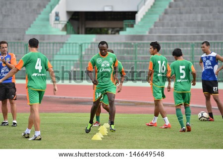 BANGKOK,THAILAND- JUNE 24: Mathew Mbuta (center) of Army United in action during a training session at Army stadium on June 26,2013; Bangkok,Thailand