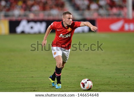 BANGKOK - JULY 13: Tom Cleverley of Man Utd. in action during Singha 80th Anniversary Cup Manchester United vs Singha All Star at Rajamangala Stadium on July 13,2013 in Bangkok, Thailand.