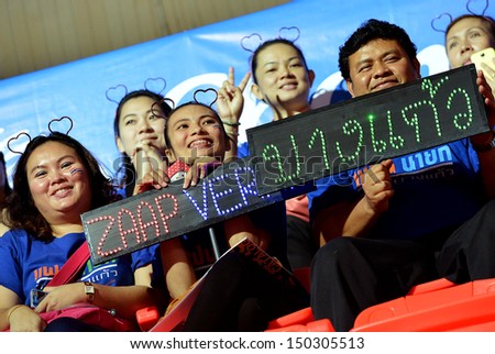 BANGKOK,THAILAND-AUGUST 16,2013:Unidentified supporters on stand cheer and banner cheer during FIVB Volleyball World Grand Prix 2013 at Indoo stadium on August 16,2013 in Bangkok,Thailand
