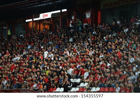 BANGKOK,THAILAND-SEP 14:The subporter of of MTUTD in action during football Thai Premier League 2013 between Muangthong United and TOTSC at SCG stadium on Sep 14,2013 in Thailand.