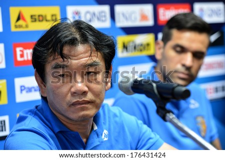 NONTHABURI-FEB7,2014:Phan Thanh Hung (L) head coach of Hanoi T&T in action during press conference AFC Champions League 2014 between MTUTD and Hanoi  at Chonburi Stadium on February7,2014 in Thailand