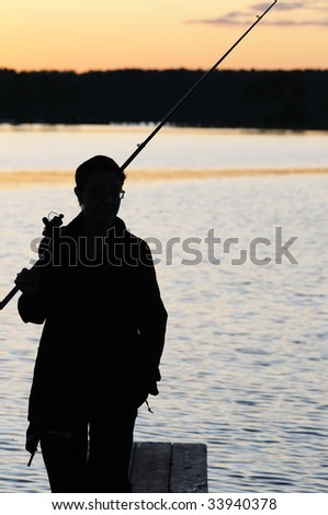 silhouette of alone fisherman