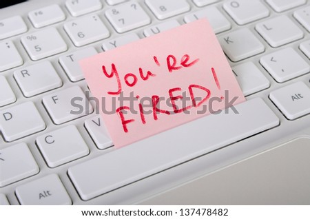 Job dismissal notice is on computer keyboard