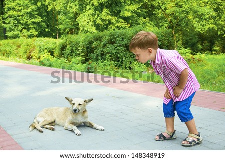 Boy talks to dog