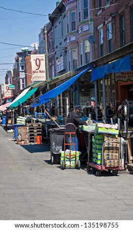 PHILADELPHIA, PA-APRIL 5:   A vendor busily prepares his market stand at PhiladelphiaÃ¢Â?Â?s Italian Market on April 5, 2013. It is the oldest and largest working outdoor market in the US.