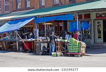 PHILADELPHIA, PA-APRIL 5:   A vendor greets shoppers at his market stand at PhiladelphiaÃ¢Â?Â?s Italian Market on April 5, 2013. It is the oldest and largest working outdoor market in the US.