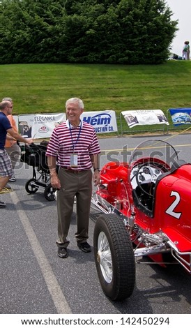 HERSHEY, PA-JUNE 16, 2013: Dick Vermeil stands by his vintage sprint car at the Elegance at Hershey on June 16, 2013. Vermeil is the former head coach of the Eagles, Rams and Chiefs football teams.