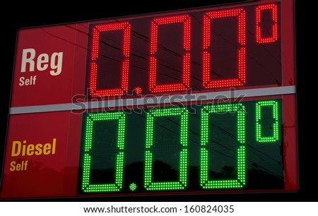 Gas prices crash!  Sign at an out of business gas station makes motorists smile and wish for the impossible.