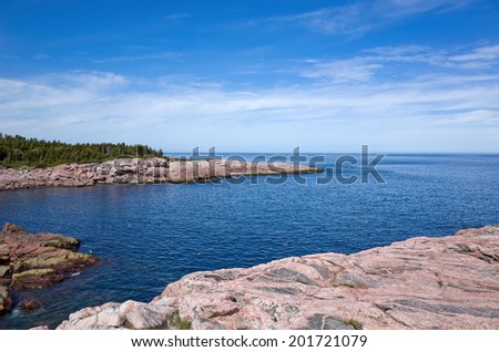 Cape Breton Highlands National Park provides many scenic views.  Cape Breton Island, part of the province of Nova Scotia, Canada is composed of rocky shores, farmland, glacial valleys, and mountains.