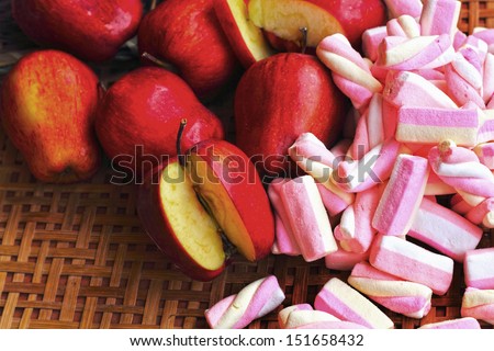 Fruit apple red with pink marshmallows.