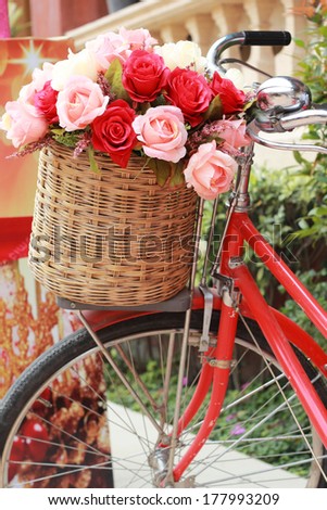 beautiful of rose artificial flowers in vintage bicycle