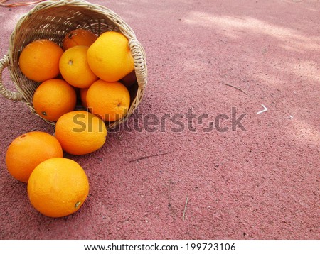 orange fruits in wicker basket