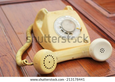 old phone vintage style on the wooden floor.