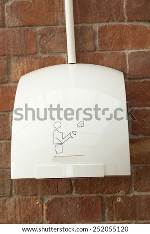 Hand dryer in public toilet