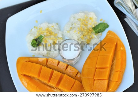 sticky rice with coconut milk mix and ripe mango.