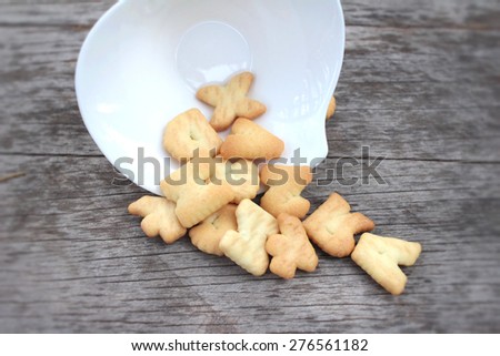 Salty crackers delicious is on the wood background.