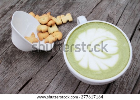 Green tea with milk and crackers delicious.