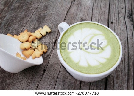 Green tea with milk and crackers delicious.